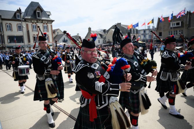 Musicians perform during a British veterans parade in Arromanches-les-Bains on Thursday.