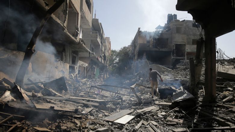 Palestinians look at the aftermath of the Israeli bombing in Nuseirat refugee camp, Gaza Strip, Saturday, June 8, 2024. 