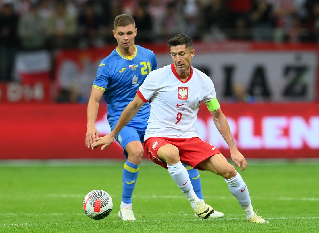 WARSAW, POLAND - JUNE 07: Robert Lewandowski of Poland is challenged by Valeriy Bondar of Ukraine during the international friendly match between Poland and Ukraine at Stadion Narodowy on June 07, 2024 in Warsaw, Poland. (Photo by Adam Nurkiewicz/Getty Images)