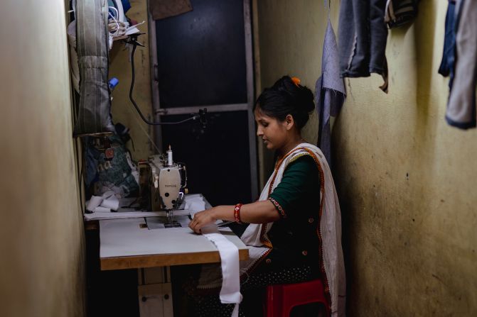 A tailor works at her workshop in the Dharavi slum area of Mumbai, India, on April 14.