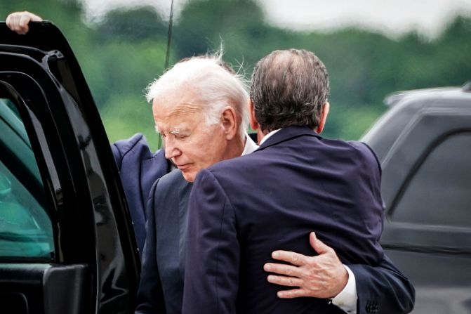 Biden embraces his son Hunter on a tarmac in Wilmington, Delaware, on Tuesday, June 11. A federal jury <a href="index.php?page=&url=https%3A%2F%2Fwww.cnn.com%2F2024%2F06%2F11%2Fpolitics%2Fhunter-biden-gun-trial-verdict" target="_blank">convicted Hunter Biden</a> on all three federal felony gun charges he faced, concluding that he violated laws meant to prevent drug addicts from owning firearms.