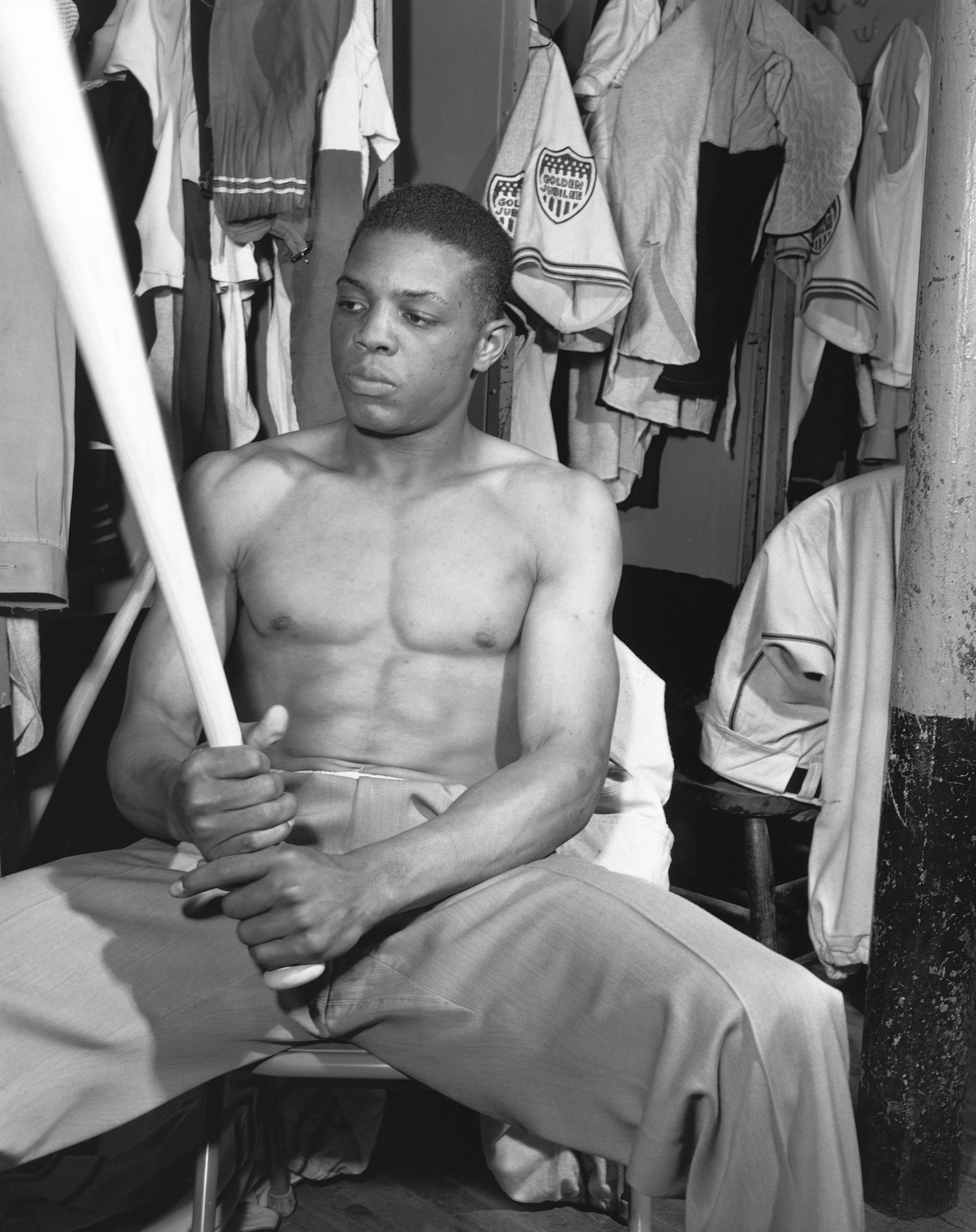 Willie Mays holds a baseball bat in the clubhouse of the American minor league team Minneapolis Millers on May 19, 1951.