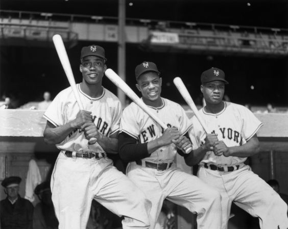 From left: Monte Irvin, Willie Mays, and Hank Thompson hold bats on their shoulders in Yankee Stadium in 1951. The New York Giants trio made up the first all-Black outfield in World Series history. All three men were playing with the New York Giants in the World Series.