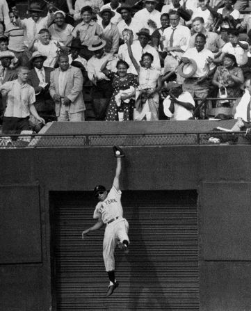 Mays makes a leaping, one-handed catch off the Los Angeles Dodgers' Duke Snider on August 15, 1954.