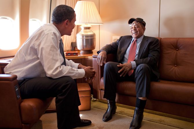 President Barack Obama, left, speaks with Mays about Air Force One en route to the MLB All-Star Game in St. Louis on July 14, 2009.