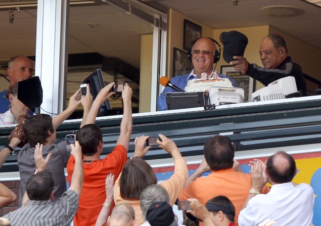 Mays waves to the crowd after he is given a birthday cake from San Francisco Giants announcer Jon Miller for Mays' 81st birthday at AT&T Park in San Francisco, California on May 6, 2012.