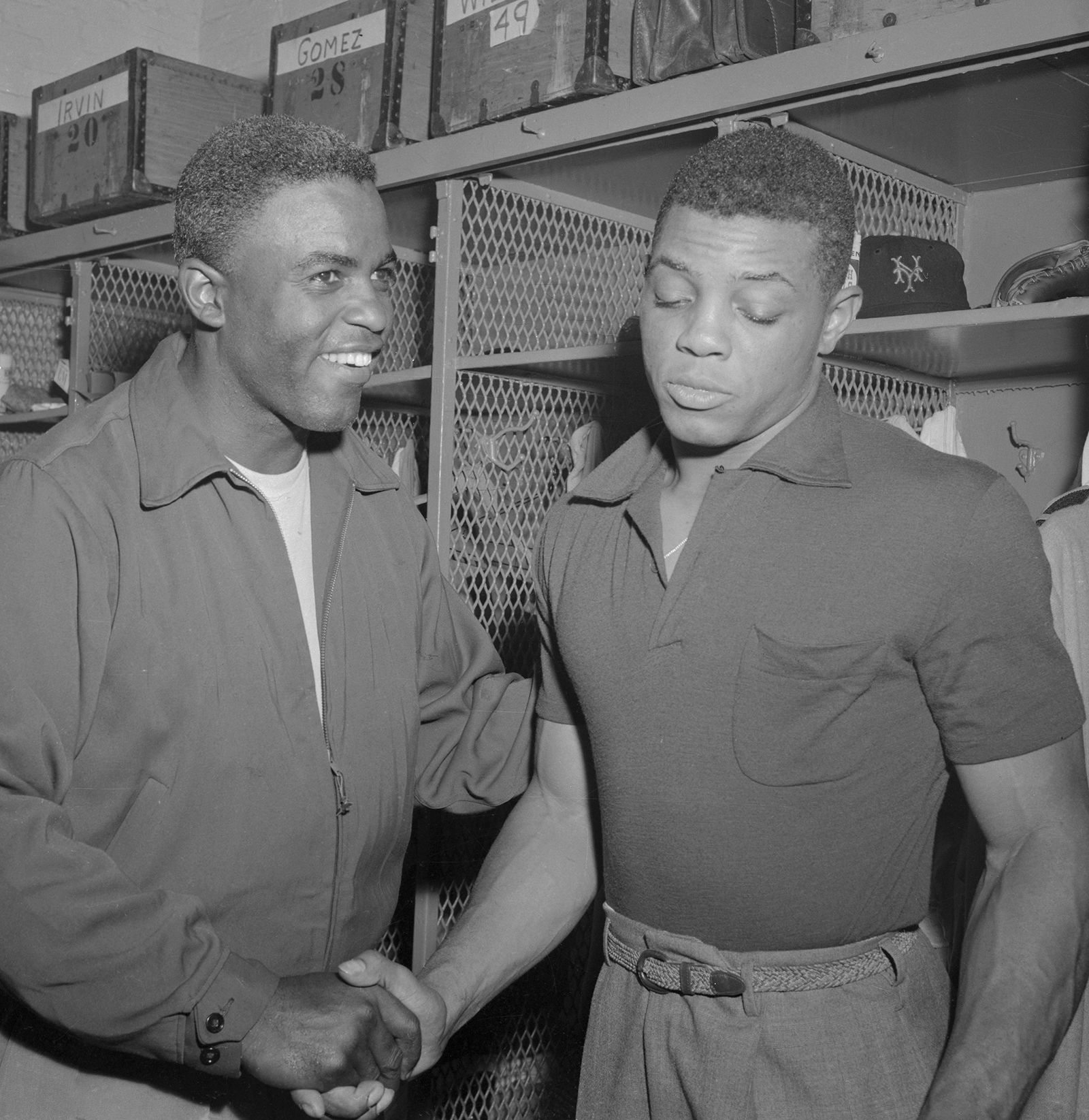 Jackie Robinson, left, congratulates Mays, after Mays' New York Giants beat Robinson's Brooklyn Dodgers 7-1, to make the World Series against the Cleveland Indians, on September 1, 1954.