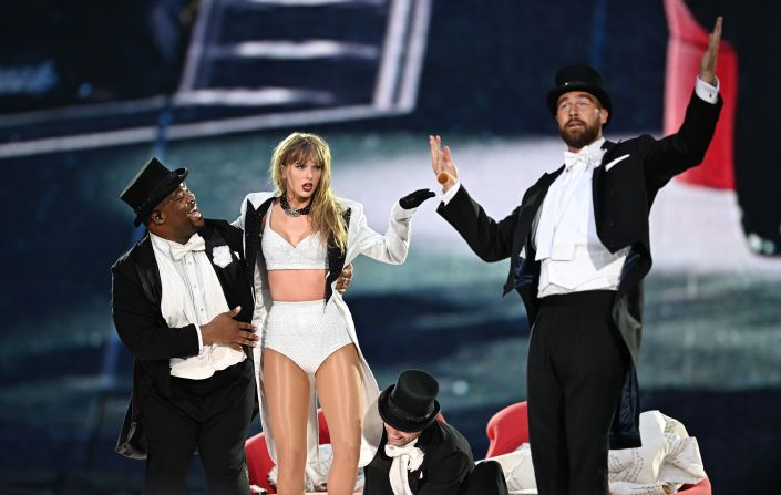 Travis Kelce, right, joins Swift on stage for <a href="https://www.cnn.com/2024/06/23/entertainment/taylor-swift-travis-kelce-on-stage/index.html" target="_blank">a surprise appearance</a> in London in June 2024. Swift and the three-time Super Bowl champ were first romantically linked in September of last year.