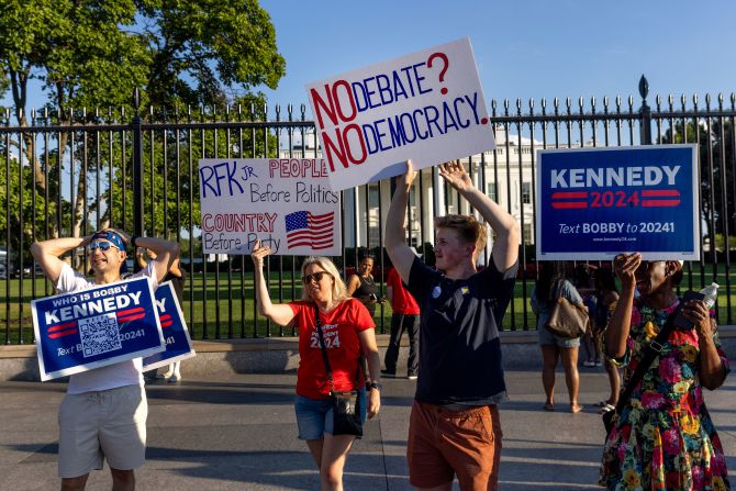 Supporters of independent candidate Robert F. Kennedy Jr. protest outside the White House on Thursday. They were upset that Kennedy was not invited to the debate.
