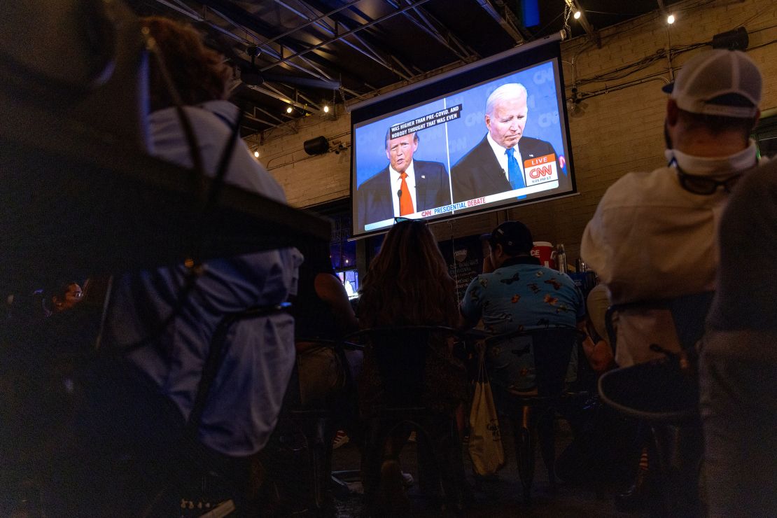 Patrons watch the CNN presidential debate during a watch party at Union Pub in Washington, DC on June 27, 2024. The debate, held in Atlanta, Georgia, marks the first in-person showdown between President Joe Biden and former President Donald Trump of the 2024 election cycle.