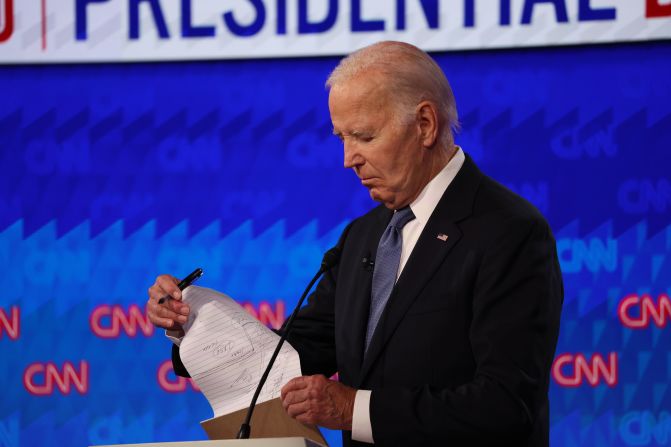 Biden looks at his notes during the debate.