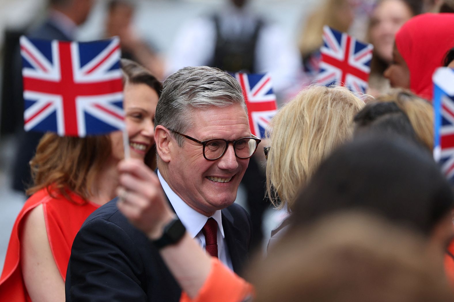 Starmer and his wife, Victoria, greet Labour campaigners and activists at No. 10 Downing Street after the election.