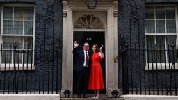 Britain's incoming Prime Minister and leader of the Labour Party, Keir Starmer, and his wife Victoria, wave as they pose on the steps of 10 Downing Street in London on July 5, 2024, a day after Britain held a general election. Starmer became Britain's new prime minister, as his centre-left opposition Labour party swept to a landslide general election victory, ending 14 years of right-wing Conservative rule. (Photo by HENRY NICHOLLS / AFP) (Photo by HENRY NICHOLLS/AFP via Getty Images)