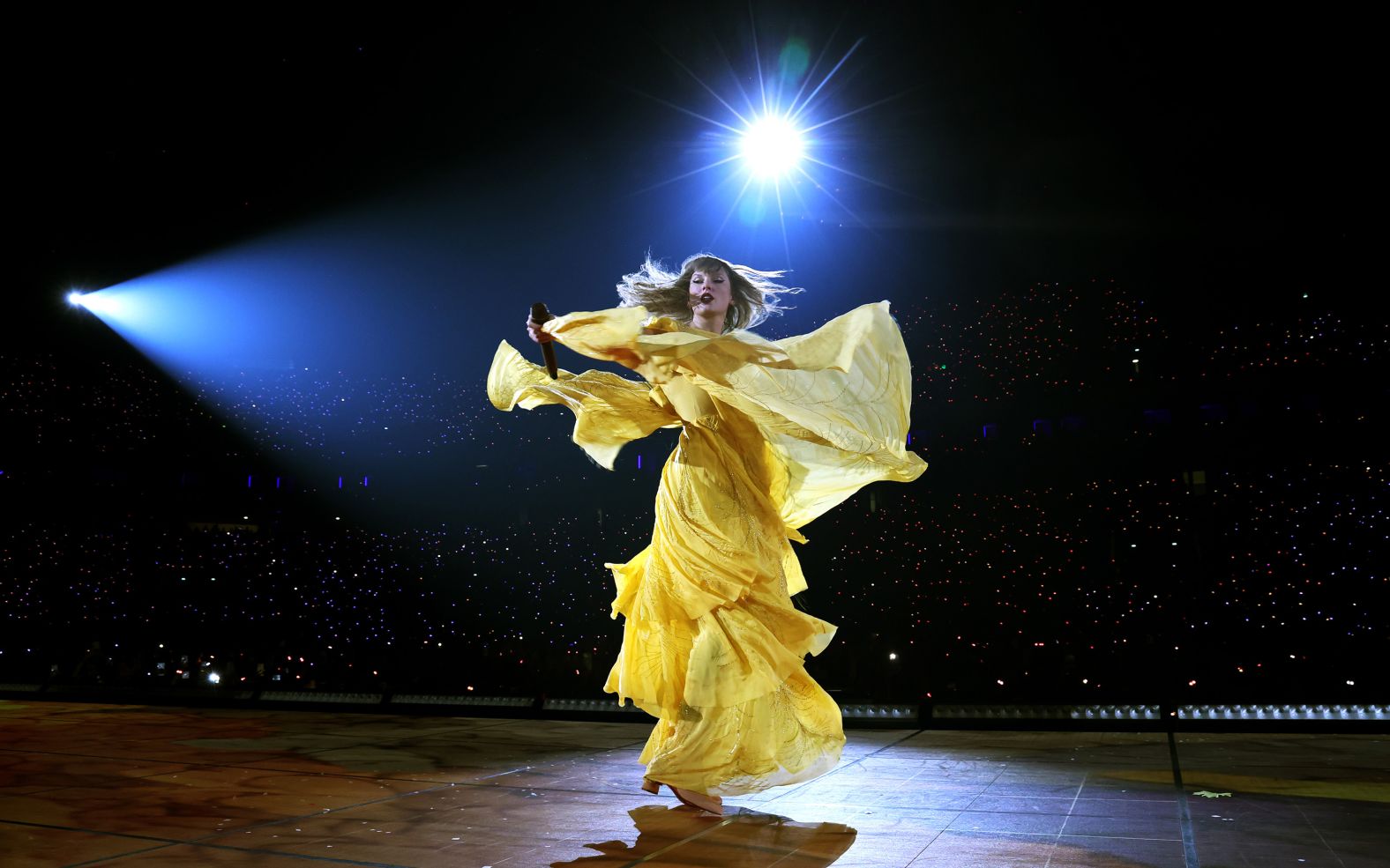 Swift twirls during the combined "Folklore" and "Evermore" section of a show in Paris in May 2024.