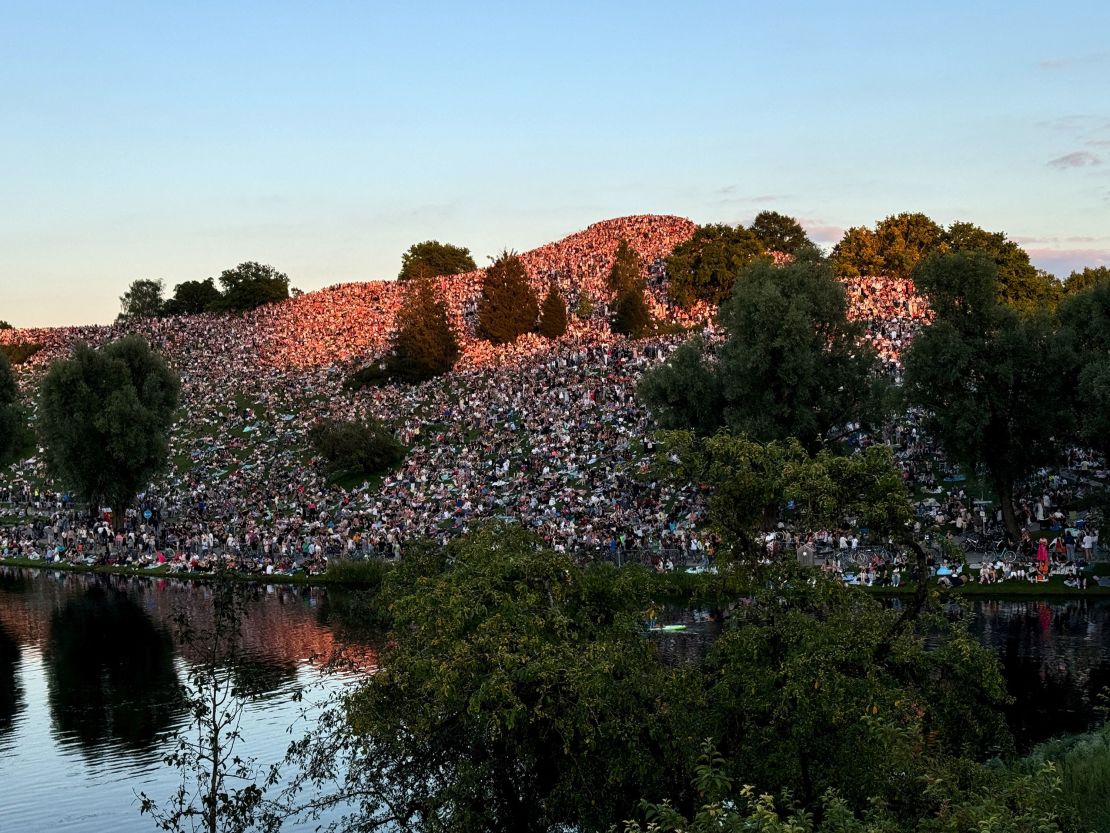 Thousands of Swift fans gather near concert venue to listen to her performance at the Olympiaberg in the Olympiapark in Munich, Germany, July 28, 2024.