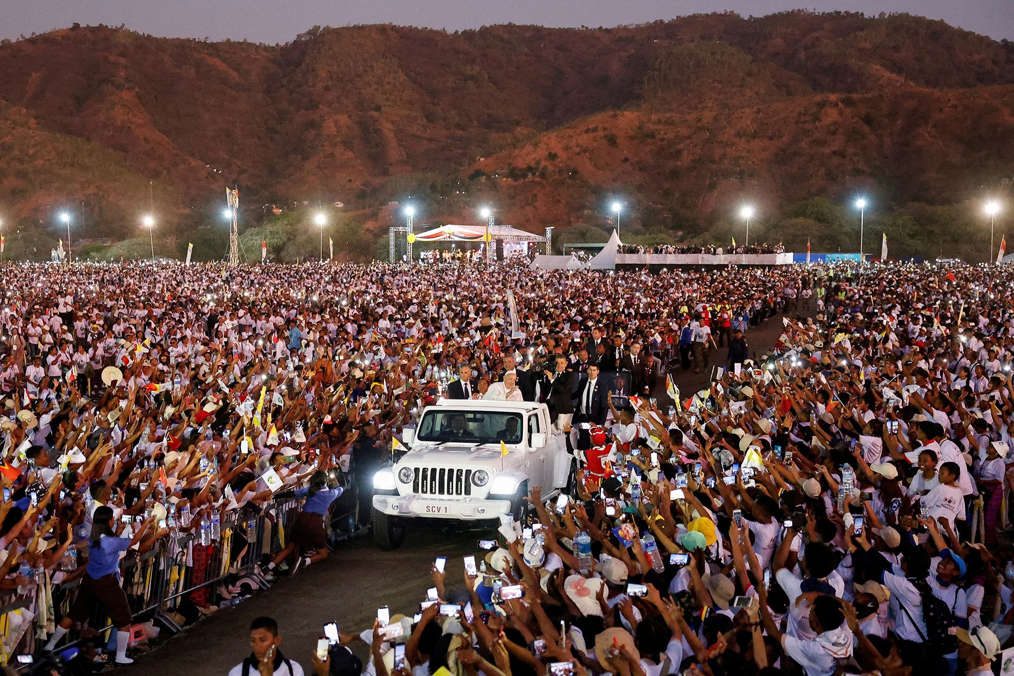 Pope Francis greets people from a car after leading a Holy Mass at the Esplanade of Tasi Tolu in Dili, East Timor, on September 10, 2024.