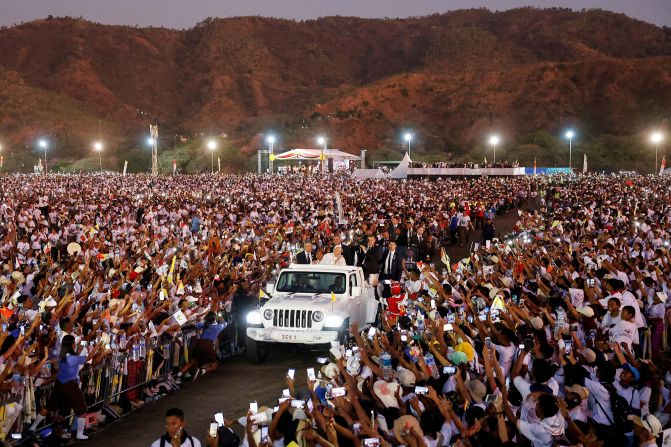 Pope Francis greets people from a car after <a href="index.php?page=&url=https%3A%2F%2Fedition.cnn.com%2F2024%2F09%2F09%2Fasia%2Fpope-francis-east-timor-intl-hnk%2Findex.html" target="_blank">leading a Holy Mass</a> at the Esplanade of Tasi Tolu in Dili, East Timor, on September 10, 2024.<br />