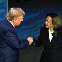 Vice President Kamala Harris (R) shakes hands with former President Donald Trump during a presidential debate at the National Constitution Center in Philadelphia, Pennsylvania, on September 10, 2024.