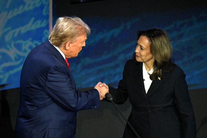 Harris shakes hands with former President Donald Trump at the start of <a href="index.php?page=&url=https%3A%2F%2Fwww.cnn.com%2F2024%2F09%2F10%2Fpolitics%2Fgallery%2Fdebate-trump-harris-photos%2Findex.html" target="_blank">their presidential debate</a> in September 2024. Harris walked over to Trump and extended her hand. He accepted the handshake. It was the first time the two had met.