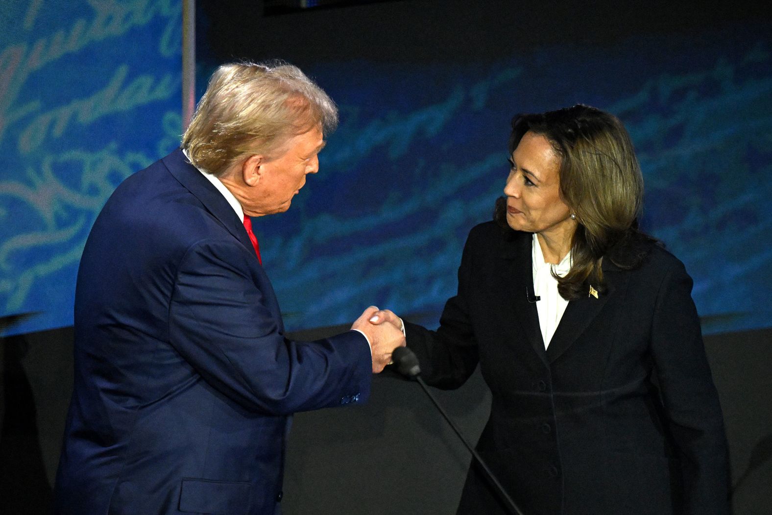 Harris shakes hands with former President Donald Trump at the start of <a href="https://www.cnn.com/2024/09/10/politics/gallery/debate-trump-harris-photos/index.html" target="_blank">their presidential debate</a> in September 2024. Harris walked over to Trump and extended her hand. He accepted the handshake. It was the first time the two had met.