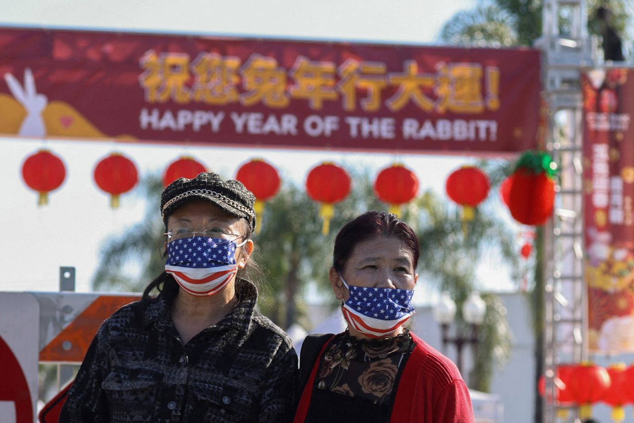 People look at the scene near the shooting in Monterey Park, California, Sunday. 