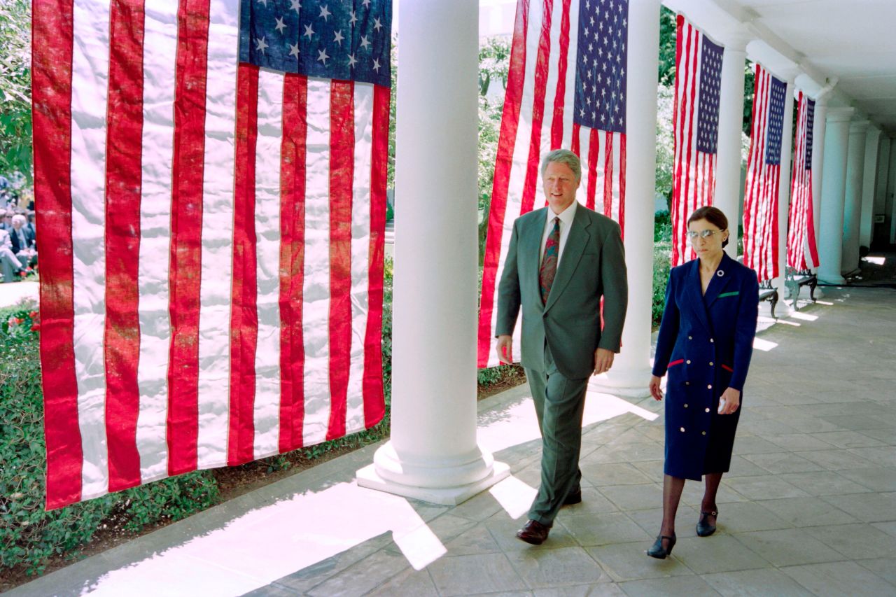 Former President Bill Clinton walks with Justice Ruth Bader Ginsburg on the way to a press conference at the White House on June 14, 1993.