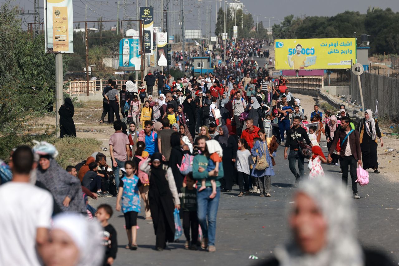 Palestinians walk down a road as they flee Gaza City and other parts of northern Gaza towards the south, on November 8.