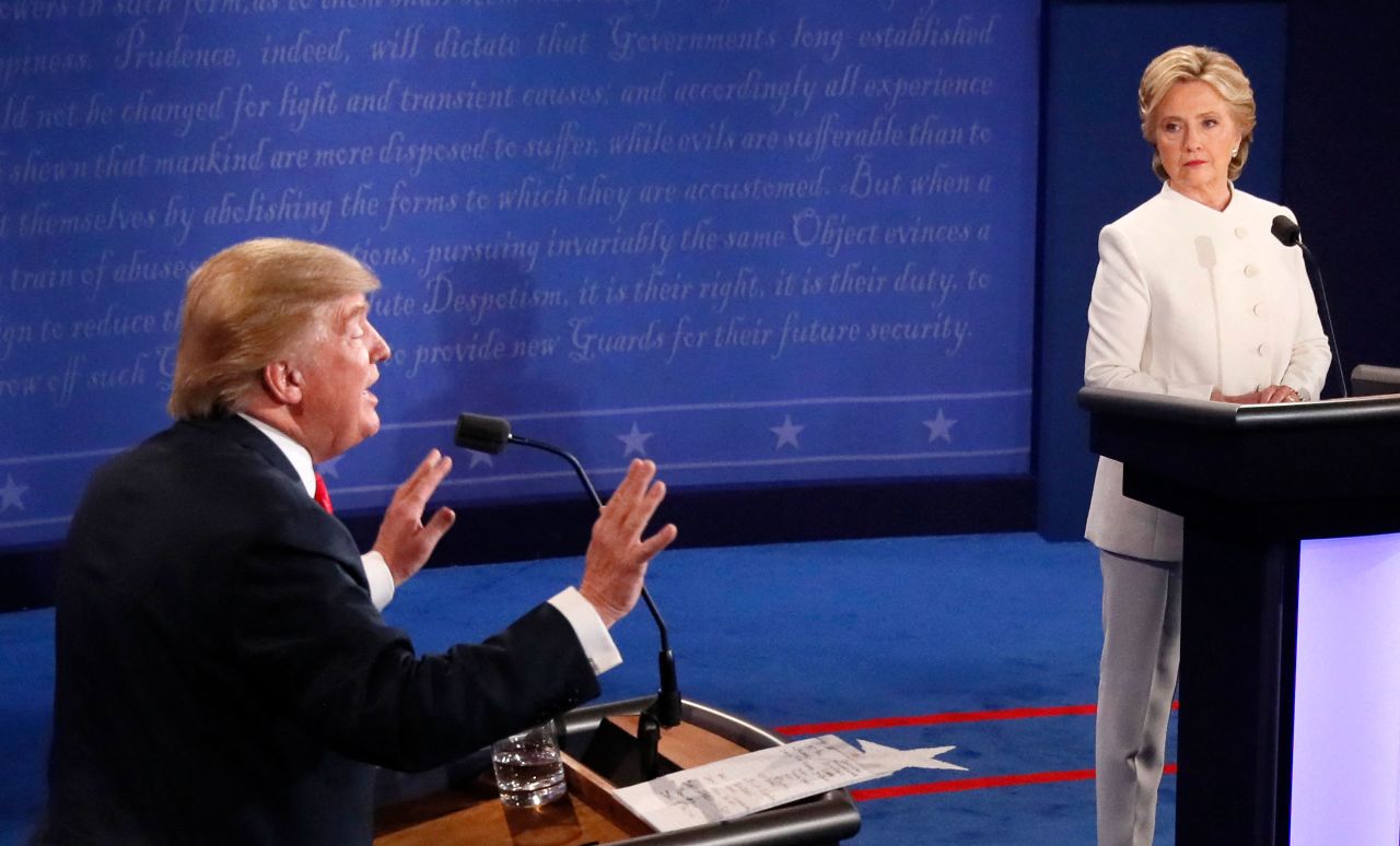 Hillary Clinton listens as Donald Trump speaks during a presidential debate in October 2016.