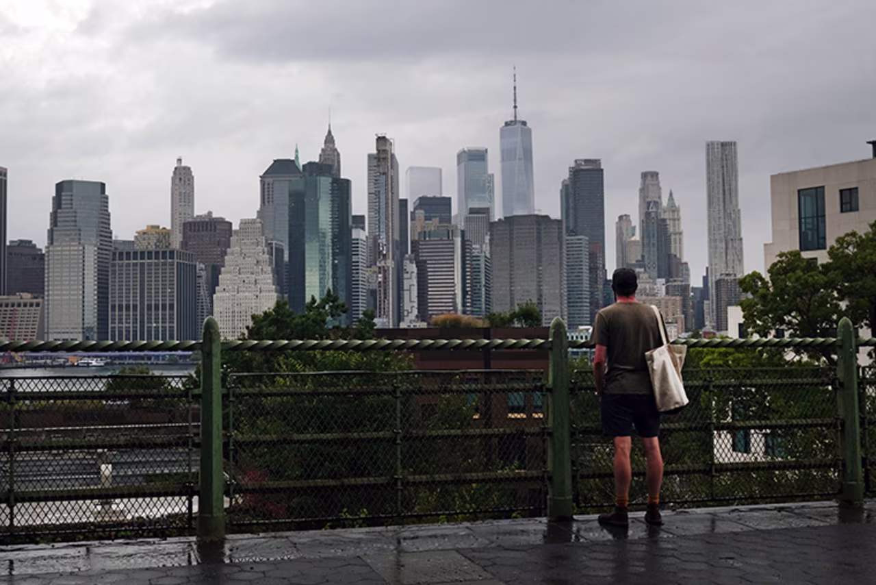 A man looks out at the Manhattan skyline in a Brooklyn neighborhood on September 29, 2020 in New York City. 