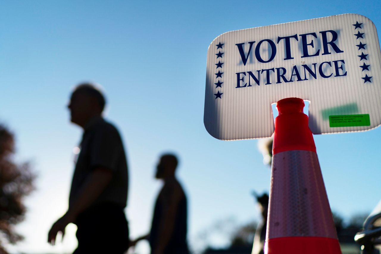 Voters pass a sign outside a polling site in Warwick, Rhode Island, in November 2022.