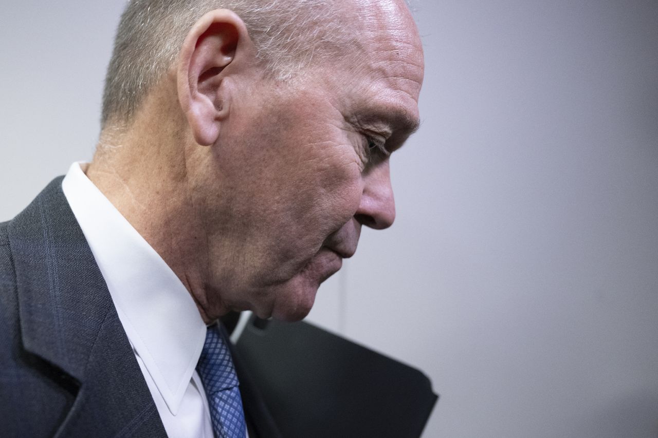 Boeing CEO Dave Calhoun walks past after speaking with reporters on Capitol Hill in Washington, DC, on January 24, 2024, before meeting with a group of senators.