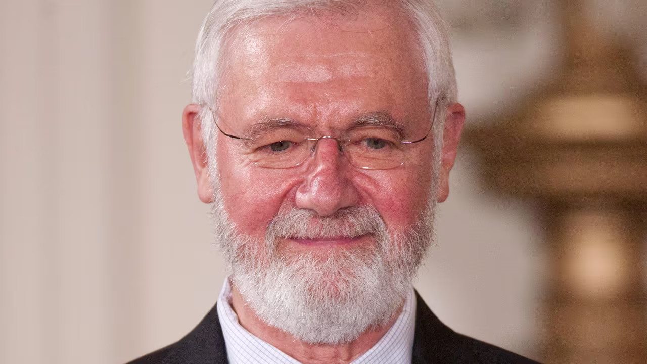 Physician and epidemiologist William Foege listens before being awarded the Presidential Medal of Freedom from President Barack Obama at the White House on Tuesday, May 29, 2012.