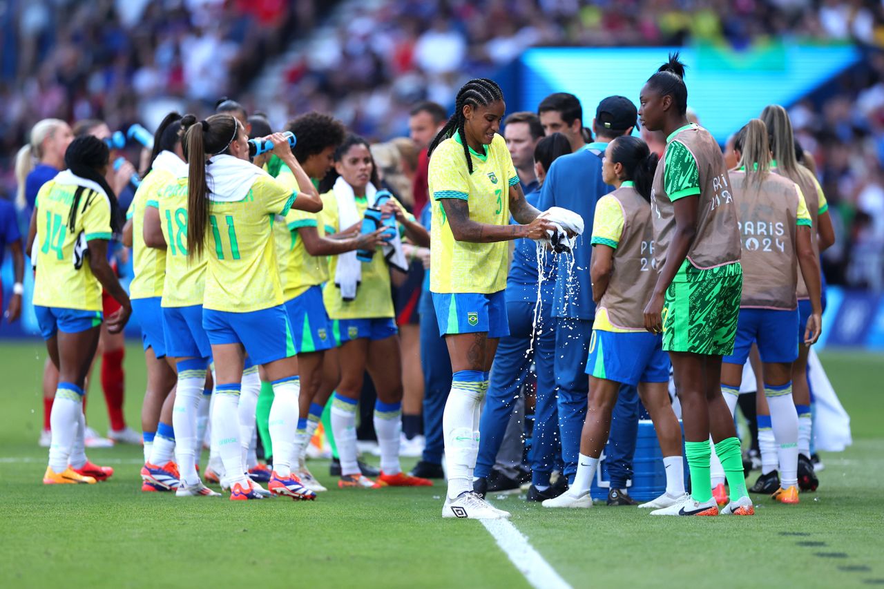 Brazil players cool off during a break in the match against the US on August 10. 