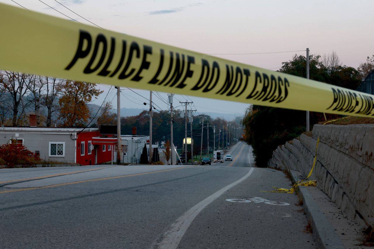 Law enforcement officials continue their investigation at Schemengees Bar & Grille on October 27, in Lewiston, Maine. 