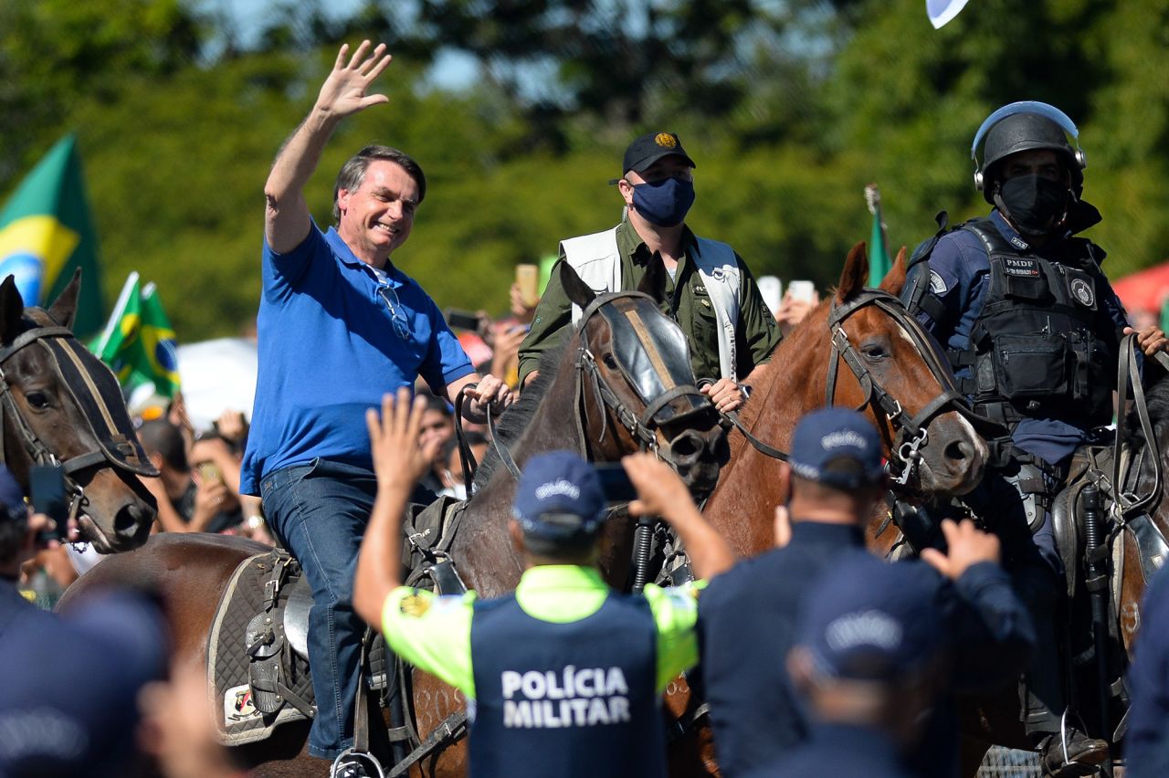 Brazilian President Jair Bolsonaro rides a horse during a demonstration in favor of his government in front of Planalto Palace on May 31 in Brasilia, Brazil. 