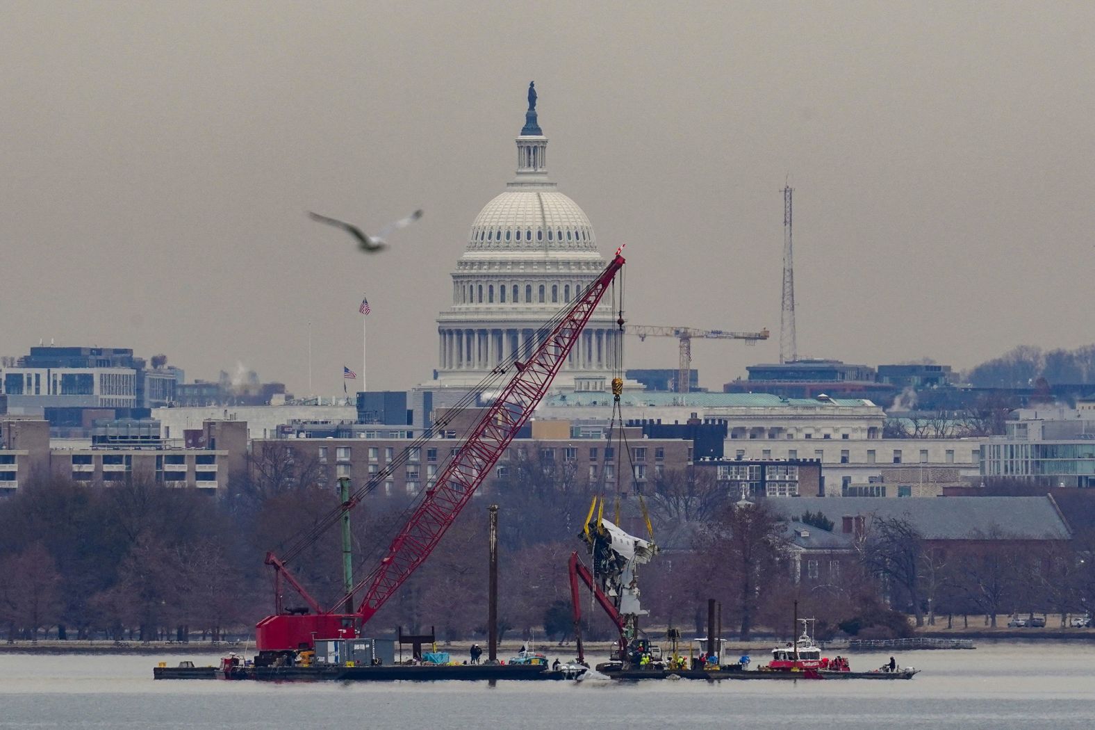 A crane retrieves wreckage from the Potomac River in Washington, DC, on Monday, February 3. The National Transportation Safety Board is investigating the <a href="https://www.cnn.com/2025/01/30/us/gallery/jet-helicopter-collision/index.html">deadly collision</a> between a passenger plane and a US Army helicopter.