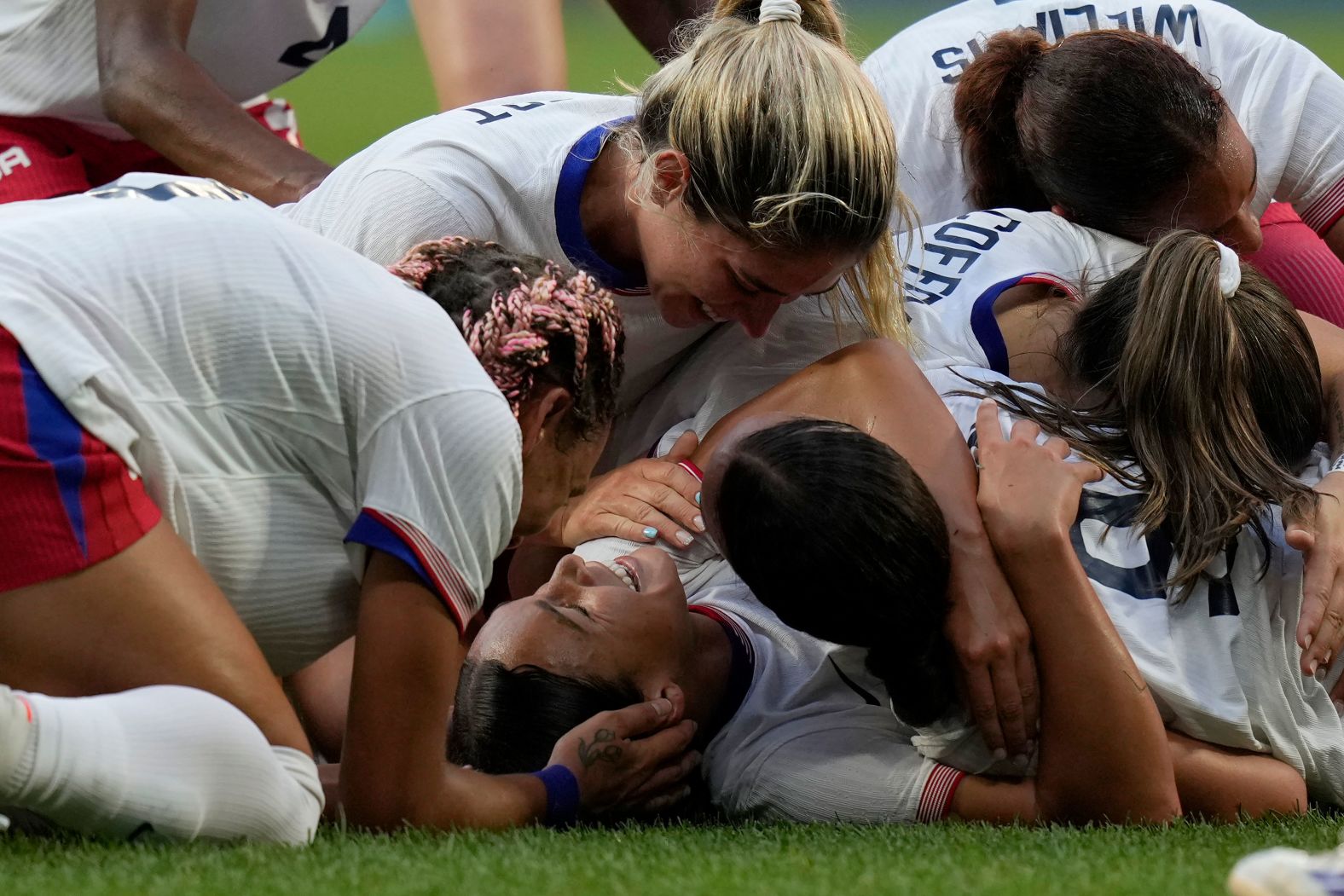 US soccer player Sophia Smith is mobbed by teammates after scoring an extra-time goal against Germany on Tuesday, August 6. The Americans won 1-0 <a href="index.php?page=&url=https%3A%2F%2Fwww.cnn.com%2Fsport%2Flive-news%2Fparis-olympics-news-2024-08-06%23h_41eda3d47e1ac9b93c1db0e569023f12">to advance to the gold-medal match</a>.