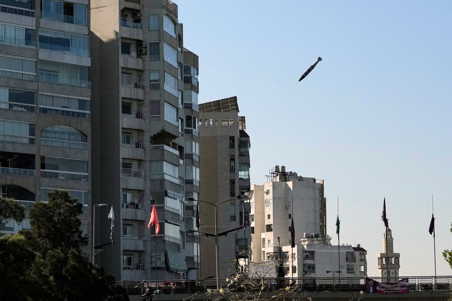 A bomb, dropped from an Israeli jet, falls toward an apartment building in Beirut’s Tayouneh area on Friday, November 15. Associated Press photographer Hassan Ammar <a href="index.php?page=&url=https%3A%2F%2Fwww.cnn.com%2F2024%2F11%2F17%2Fmiddleeast%2Flebanon-bomb-hits-building-pictures-intl%2Findex.html">captured the scene</a> after the Israeli military issued an evacuation warning with a map marking the targeted building. The Israeli army said the building contained facilities belonging to the Lebanese militant group Hezbollah. There were no immediate reports of casualties, but much of the building was reduced to rubble.