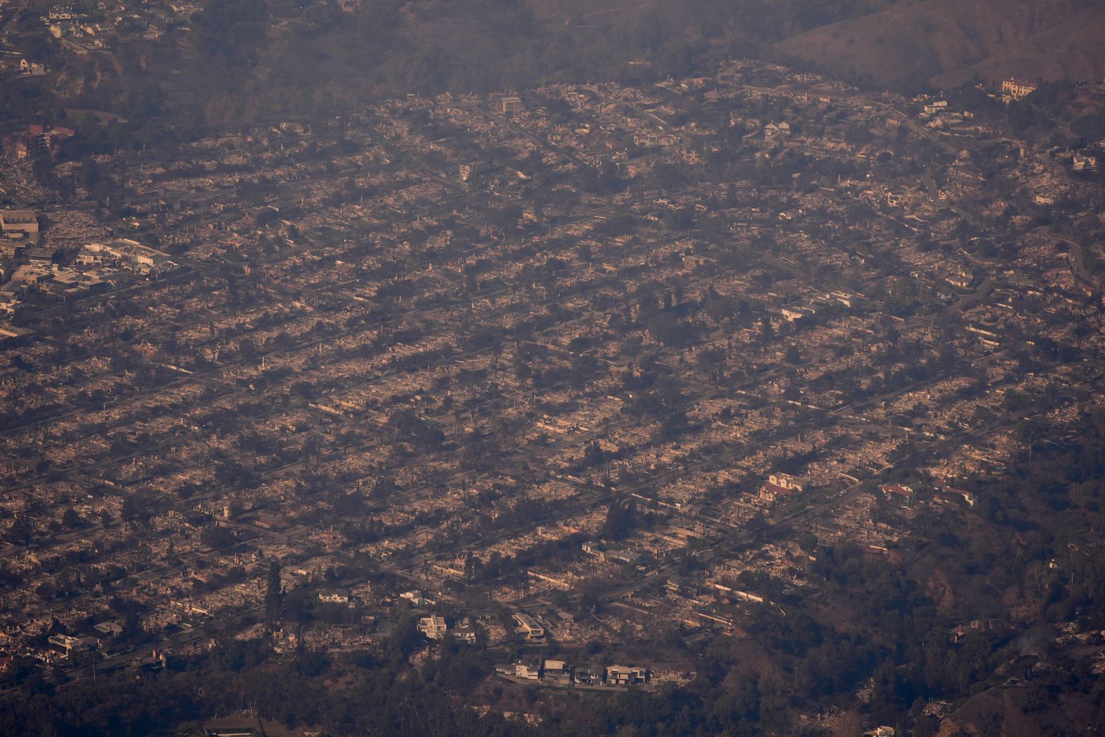 This aerial photo, taken on Thursday, January 9, shows wildfire damage in the Pacific Palisades neighborhood of Los Angeles. The Palisades Fire is the most destructive ever to hit Los Angeles County.