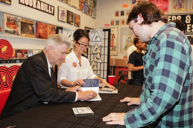 Lynch signs copies of his 2013 album "The Big Dream" at Amoeba Music in Hollywood, California.