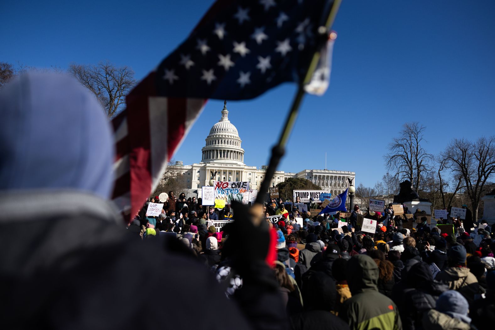 Protesters denounce the Trump administration during a <a href="https://www.cnn.com/politics/live-news/trump-administration-russia-ukraine-02-17-25#cm79n503h000z3b6m4the3vfp">demonstration near the US Capitol</a> in Washington, DC, on Monday, February 17.