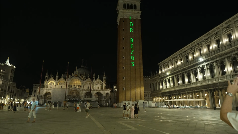 ‘No space for Bezos’ projected with laser on Venice building