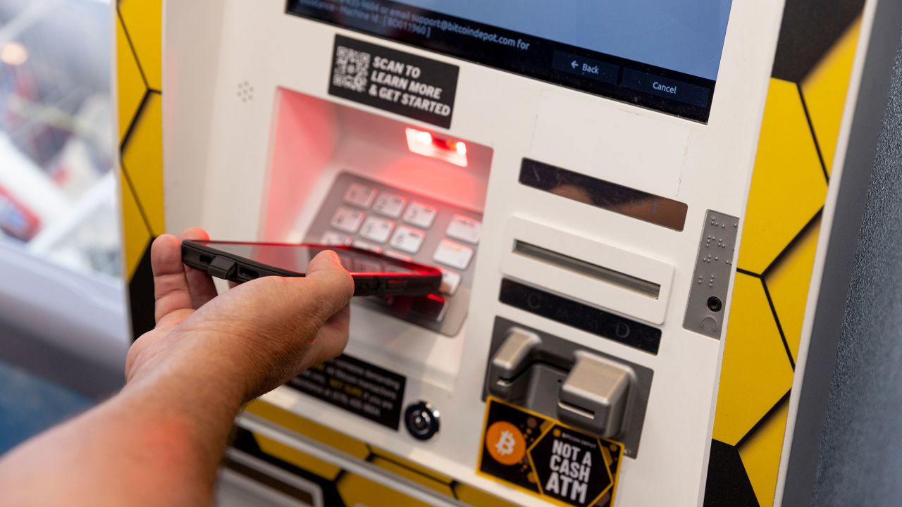 Vincent Porter, Financial Analyst for the U.S. Secret Service, uses a Bitcoin Depot cryptocurrency ATM at a convenience store in Atlanta, Georgia August 8, 2025. 
Members of the U.S. Secret Service travel around Atlanta to shops, gas stations and convenience stores where crypto ATMs are located. The agents test the machines, warn employees to look for people coming in who might be getting scammed, and leavewarning signs in the stores in Atlanta, Georgia August 8, 2025. 

Photo by Kendrick Brinson
