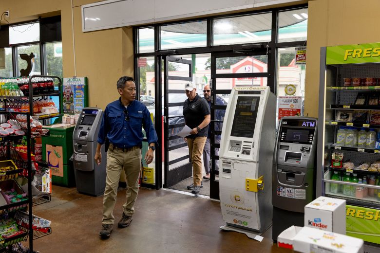 Members of the Secret Service enter a convenience store in Atlanta to test a cryptocurrency ATM in August.