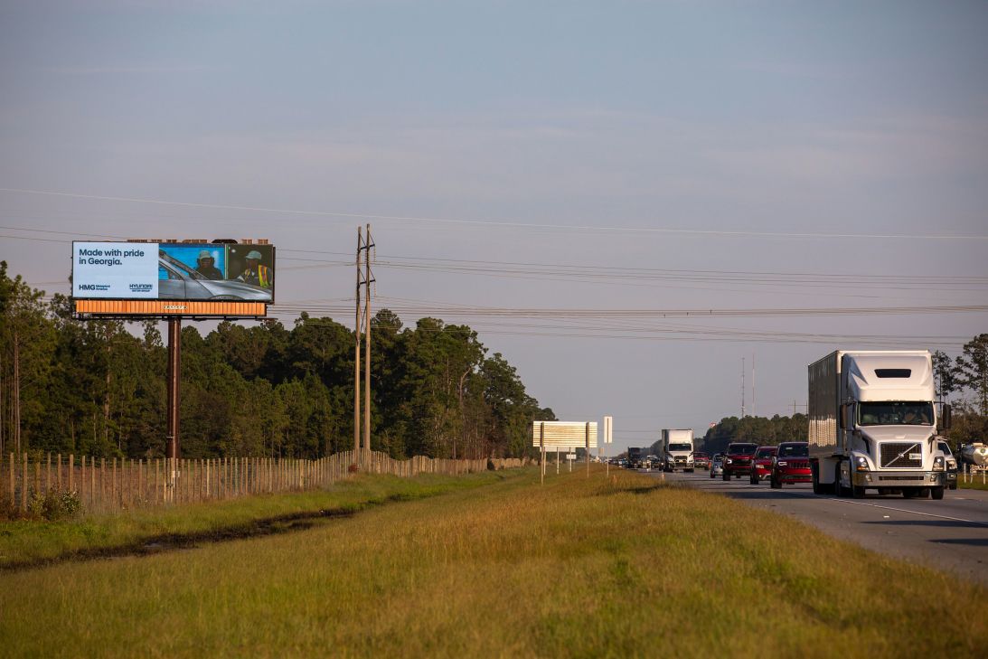 An electronic billboard along Interstate 16 displays an advertisement for the Hyundai Motor Group Metaplant America in Ellabell on Friday.