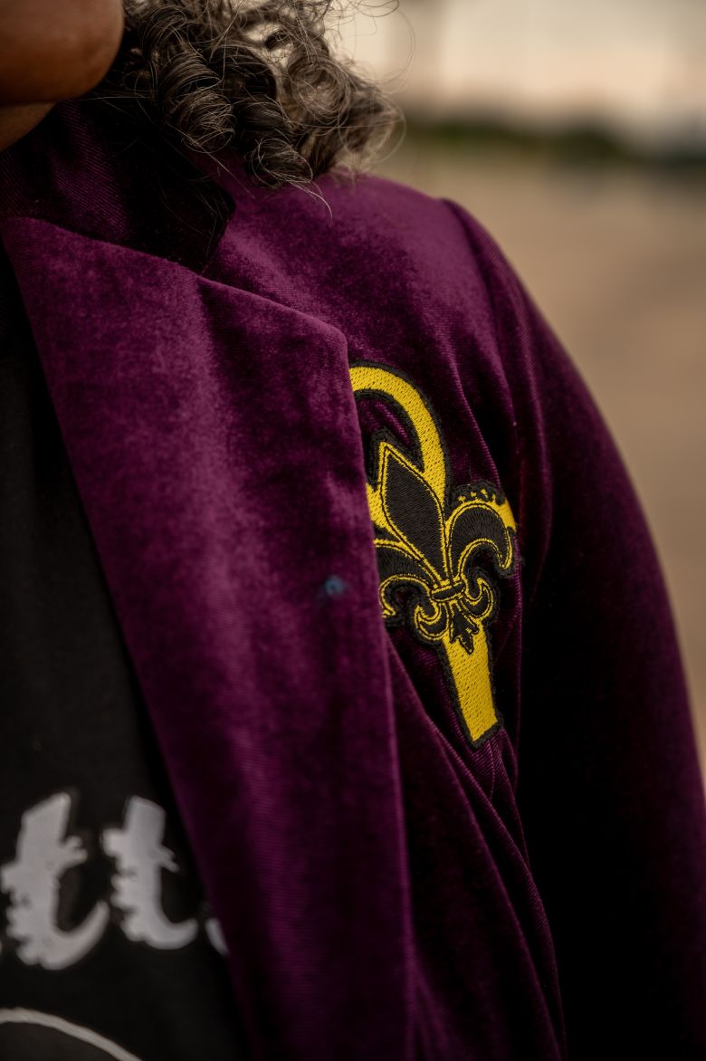 A fleur-de-lis is displayed on Christie Jourdain’s jacket that she wore during the 2025 Super Bowl LIX pregame show in New Orleans.