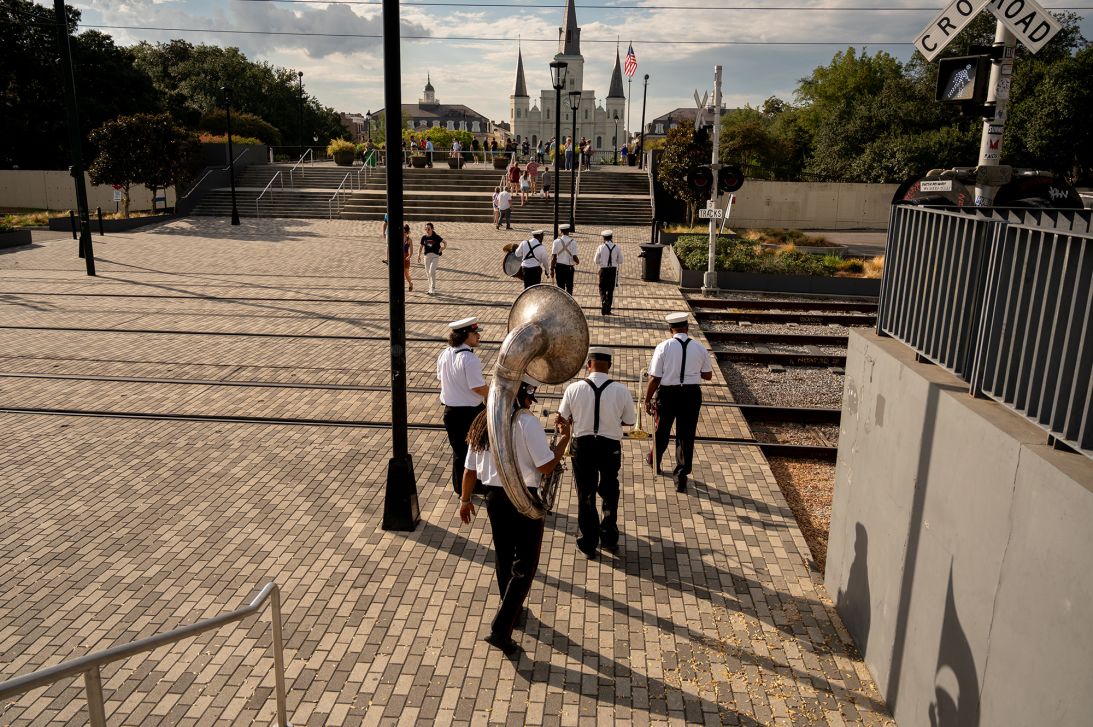 The Kinfolk Brass Band walks near New Orleans' Jackson Square.