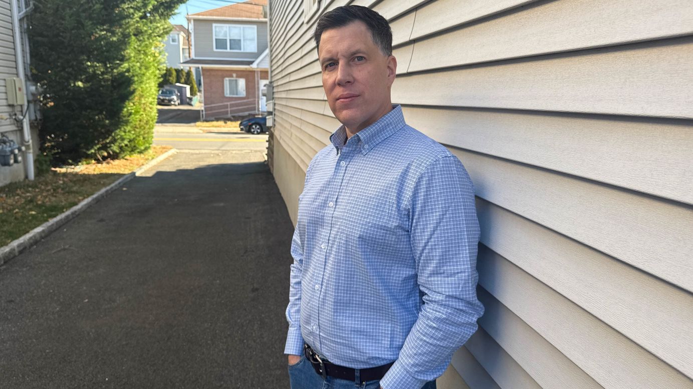 Joseph Novak poses at his home in New Jersey on November 28, 2025.