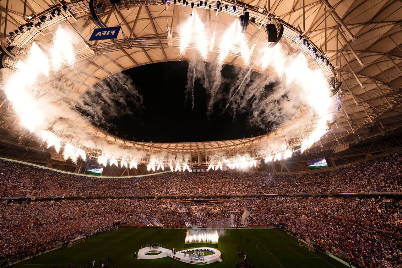 Fireworks explode as Argentina's team receives the trophy at the end of the World Cup soccer match final at Lusail Stadium in Qatar on December 18. 