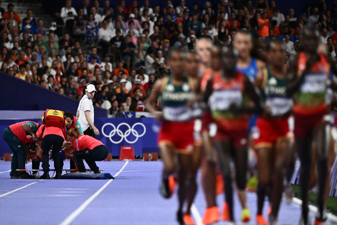 France's Alessia Zarbo receives medical attention in the women's 10,000m final.